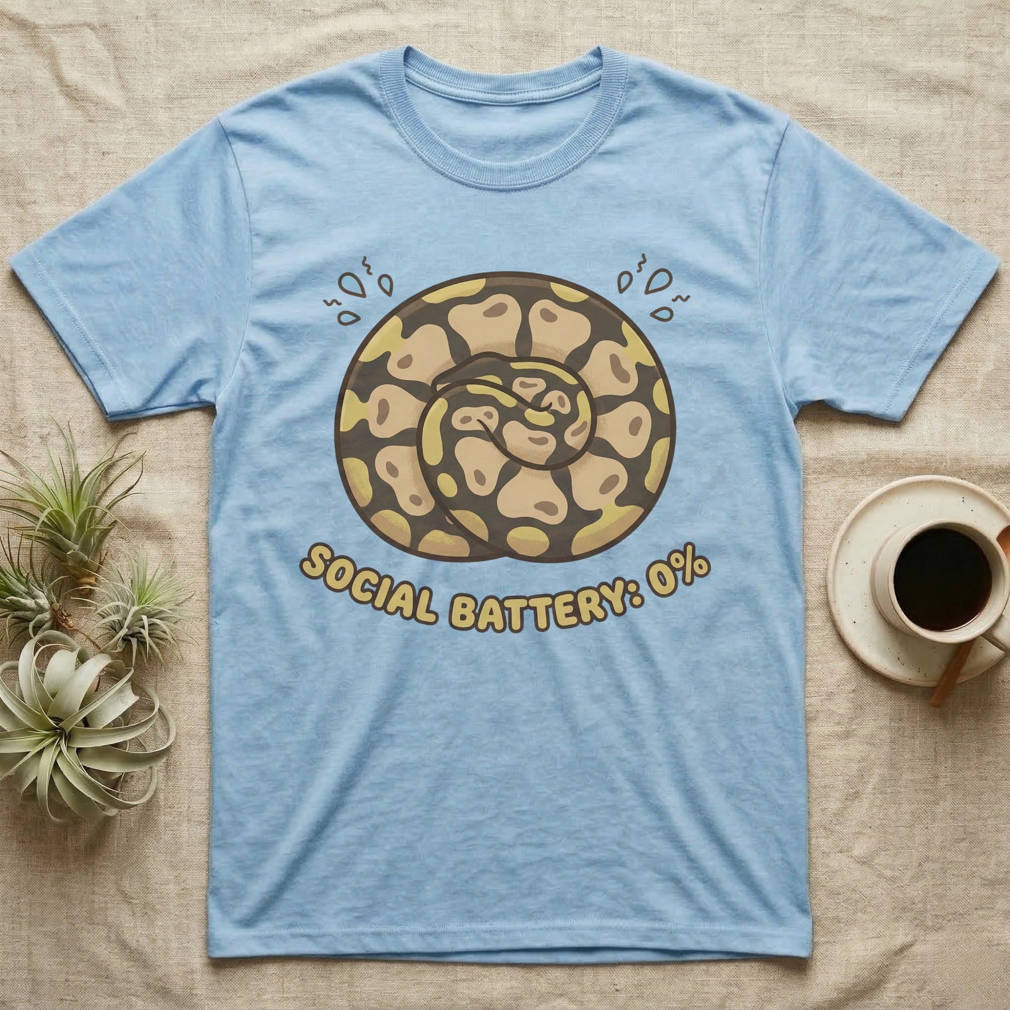 Light blue t-shirt with coiled snake design and "Social Battery: 0%" text.