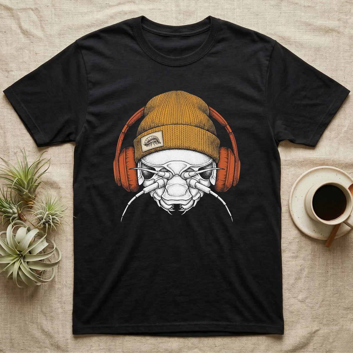 Isopod Heavy Beats T-Shirt in Black — Engraved isopod with detailed chitin plating and antennae, wearing a knit beanie and over-ear headphones.