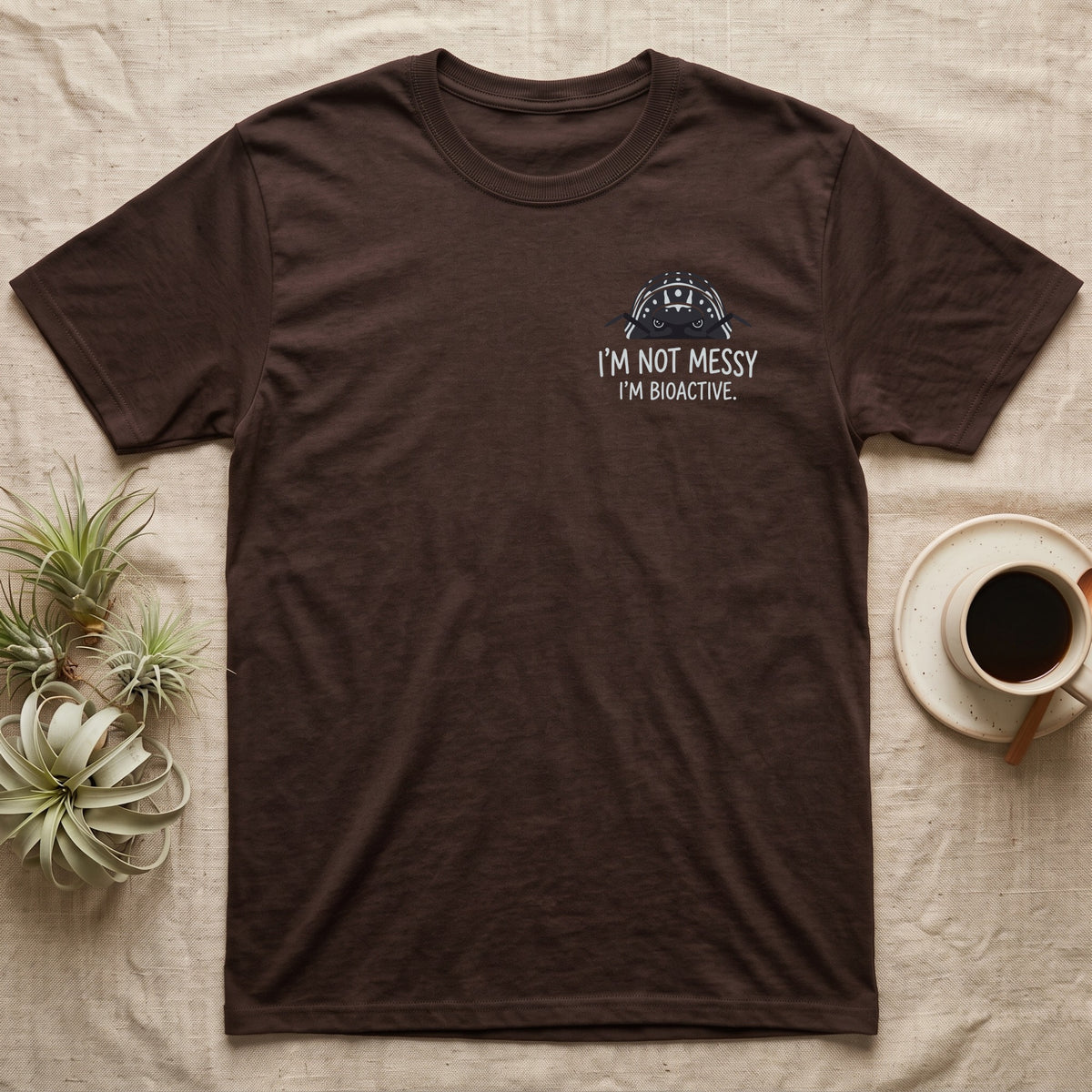 Zebra Isopod Bioactive T-Shirt in Dark Chocolate — Striped zebra isopod peeking over white marker capitals reading I'M NOT MESSY I'M BIOACTIVE.