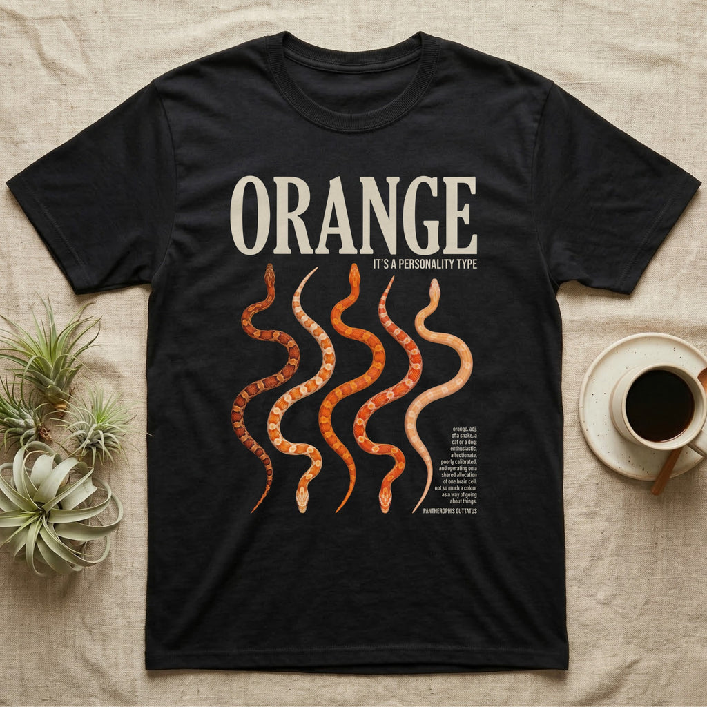Corn Snake Morphs Orange Personality T-Shirt in Black — Photo collage of seven orange corn snake morphs beneath a large serif headline and a dictionary block.