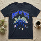 Cobalt Blue Tarantula Feral T-Shirt in Navy — Cobalt blue tarantula with electric-blue legs under jagged cobalt metal text PRETTY BUT PSYCHO with pastel blossoms