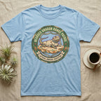 Bearded Dragon Pancake Inspector T-Shirt in Light Blue — Weathered ranger badge of a bearded dragon flattened on a rock, "Bearded Dragon Range Patrol, Official Pancake Inspector."