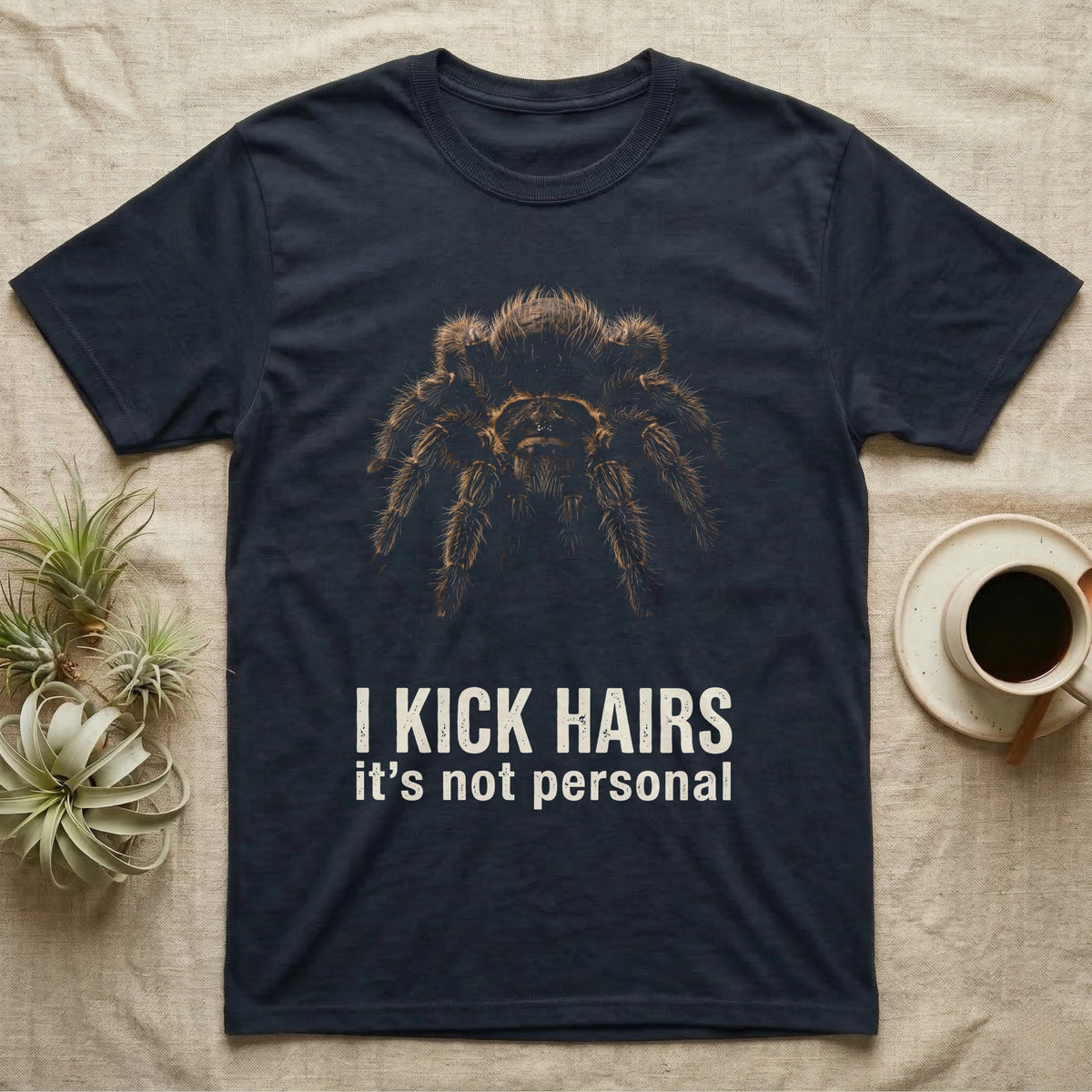 Deadpan photographic mugshot of a curly hair tarantula facing the camera above the distressed text I Kick Hairs, it's not personal. — shown on a Navy tee.
