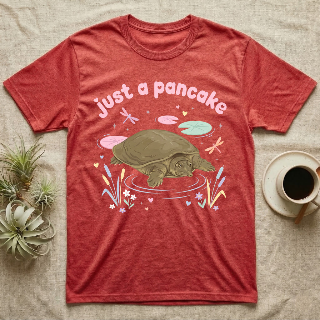 Spiny Softshell Turtle Baby T-Shirt in Heather Red — Pastel spiny softshell turtle with flat shell and snorkel nose among lily pads, puffy pink wordmark "just a pancake" above.