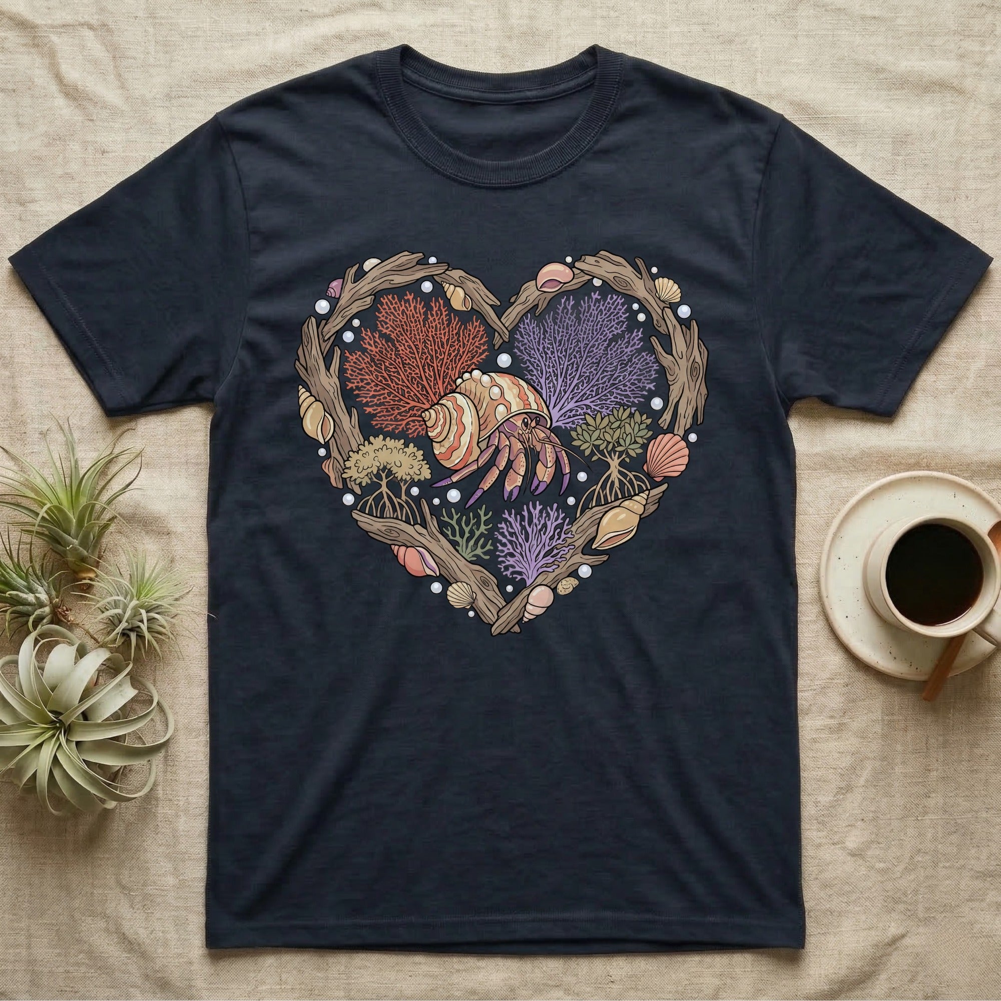 Dark t-shirt with heart-shaped natural design featuring hermit crab and seashells.