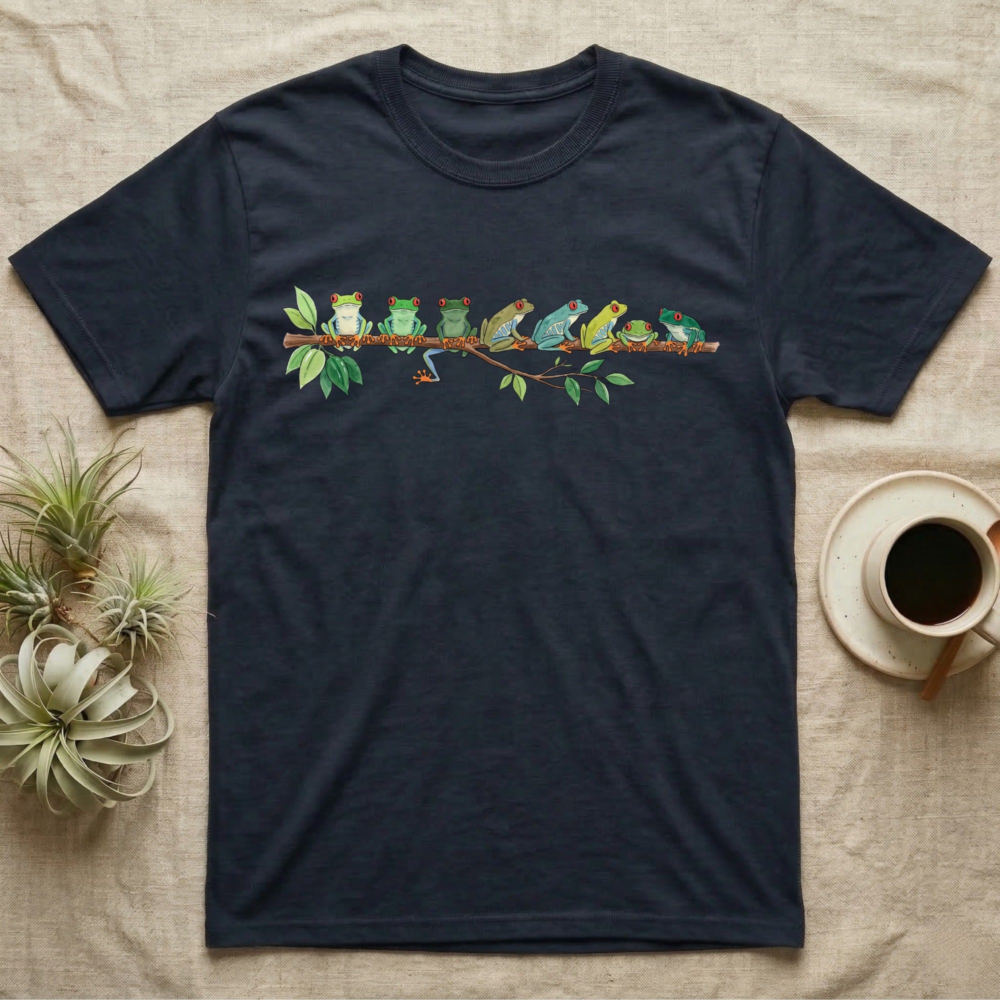 Red-Eyed Tree Frog Canopy Crew T-Shirt in Navy — Watercolor illustration of seven red-eyed tree frogs in varied green hues on a branch, dark grey T-shirt design.