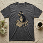 T-shirt featuring a cartoon rat in a hat sitting on a stack of old documents.