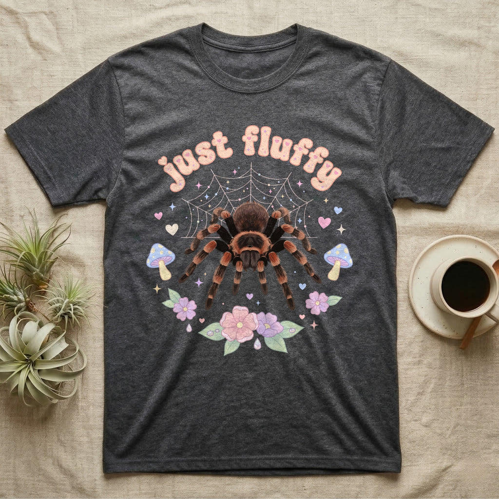 Mexican Redknee Tarantula Baby T-Shirt in Dark Heather — Fuzzy Mexican redknee tarantula on a pastel web with blossoms under puffy peach bubble text "just fluffy".