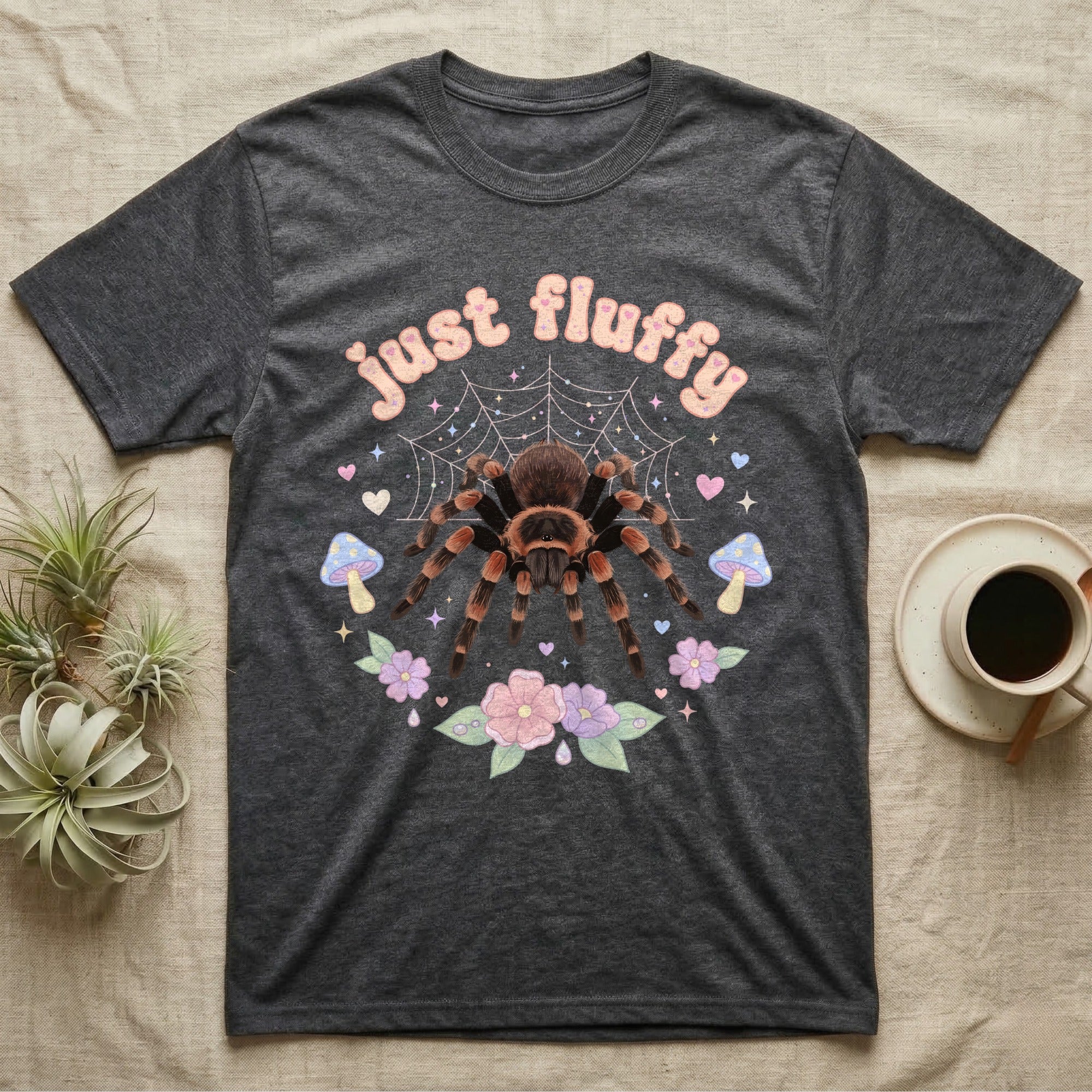 Mexican Redknee Tarantula Baby T-Shirt in Dark Heather — Fuzzy Mexican redknee tarantula on a pastel web with blossoms under puffy peach bubble text "just fluffy".