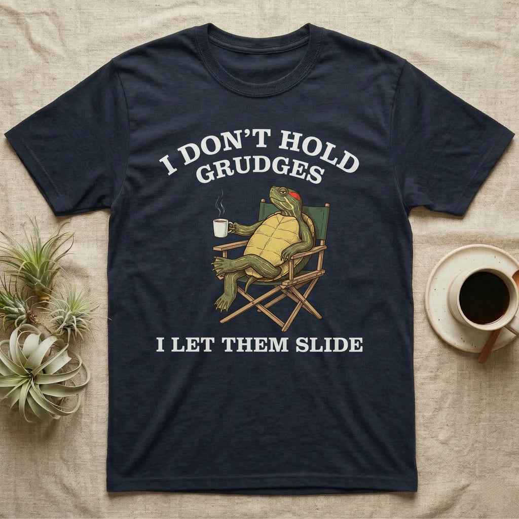 Red-Eared Slider Grudges T-Shirt in Navy — Engraved red-eared slider lounging in a camp chair with tea under I Don't Hold Grudges I Let Them Slide