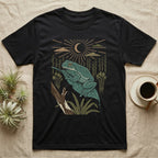 White's Tree Frog Home Range T-Shirt in Black — Woodcut-style illustration of a White's tree frog resting on a broad wet leaf with reed stems and a crescent moon behind, no on-shirt text.