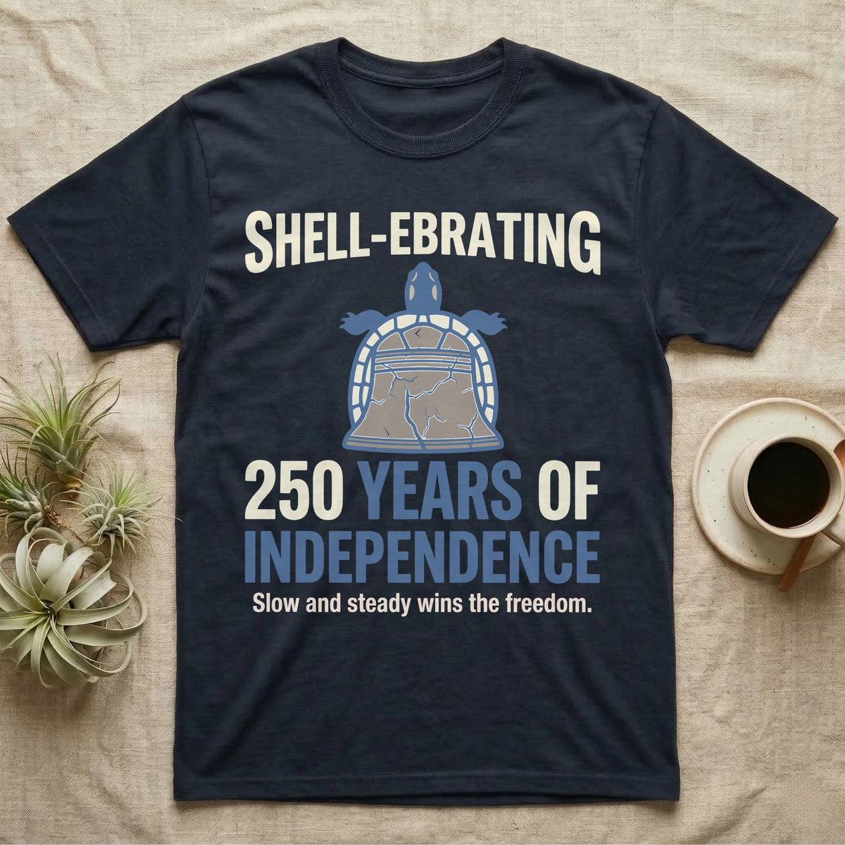 Sea Turtle Liberty Bell T-Shirt in Navy — Slate-blue and cream tee of a sea turtle whose shell is drawn as the Liberty Bell under Shell-Ebrating 250 Years text.