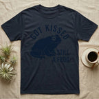 Tree Frog Kissed T-Shirt in Navy — Worn navy silhouette of a dumpy White's tree frog under the words Got Kissed Still A Frog