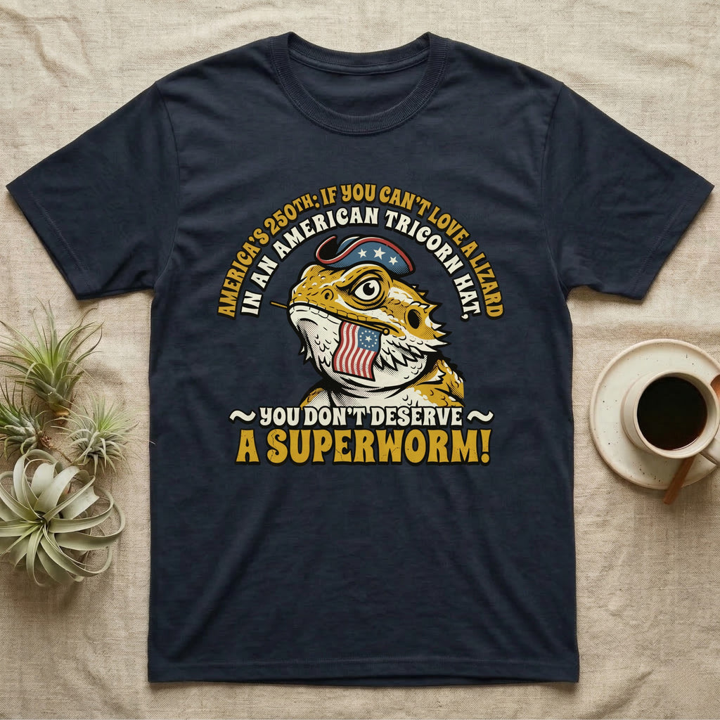 Bearded Dragon Tricorn Tee in Navy — Bold woodcut tee of a bearded dragon in a colonial tricorn hat, gold and cream text reading You Don't Deserve A Superworm, on black.