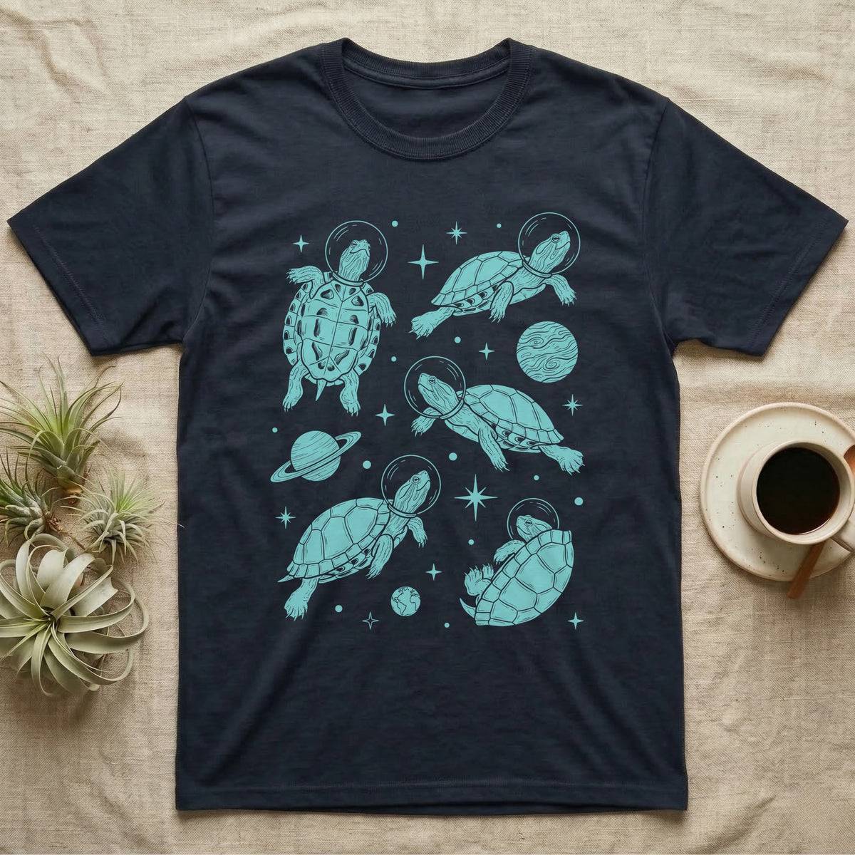 Red Eared Slider Cosmic T-Shirt in Navy — Vintage screen-print illustration of red-eared slider turtles in astronaut helmets floating in space, cosmic teal monochromatic on dark background.