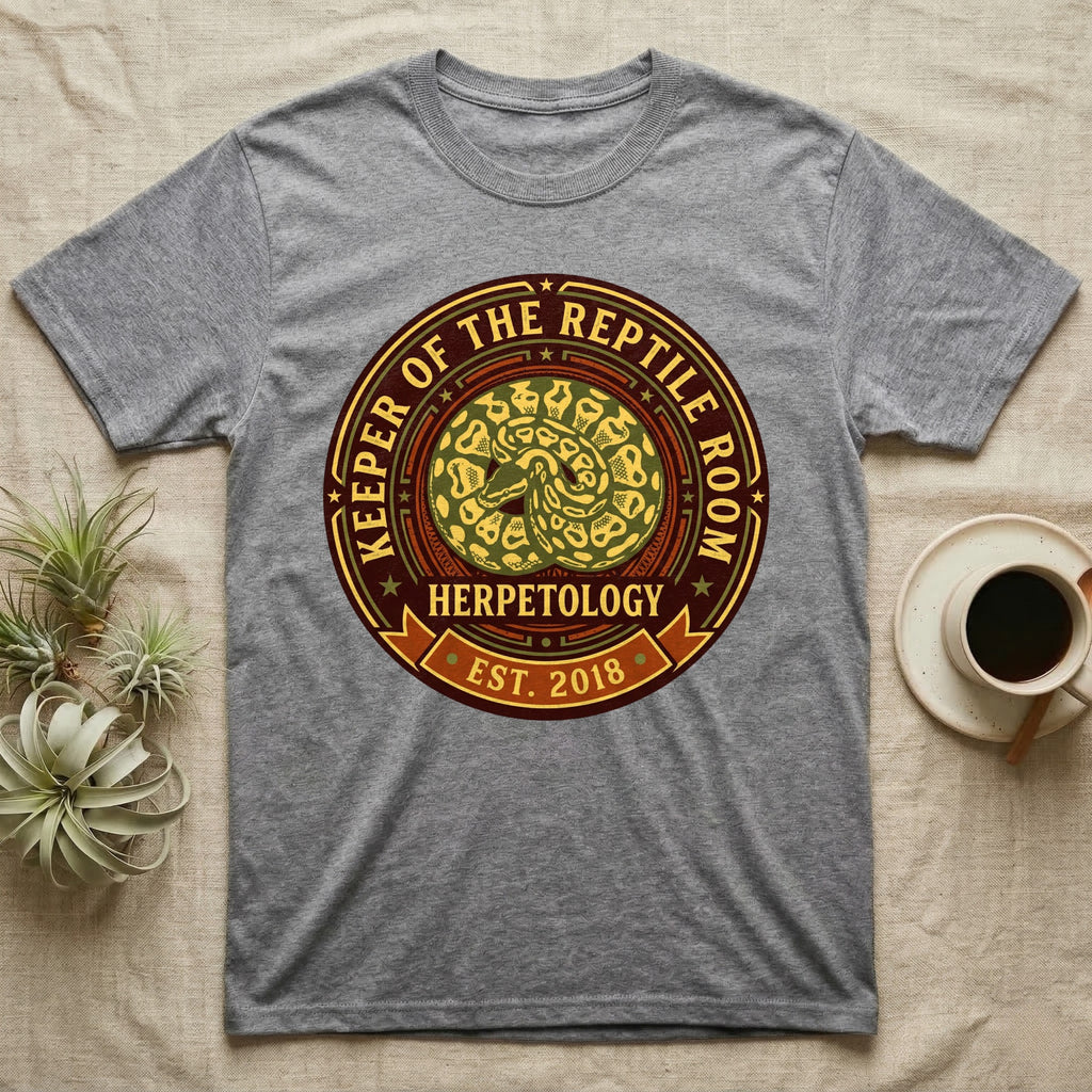 Grey t-shirt with a circular graphic for "Keeper of the Reptile Room Herpetology Est. 2018".