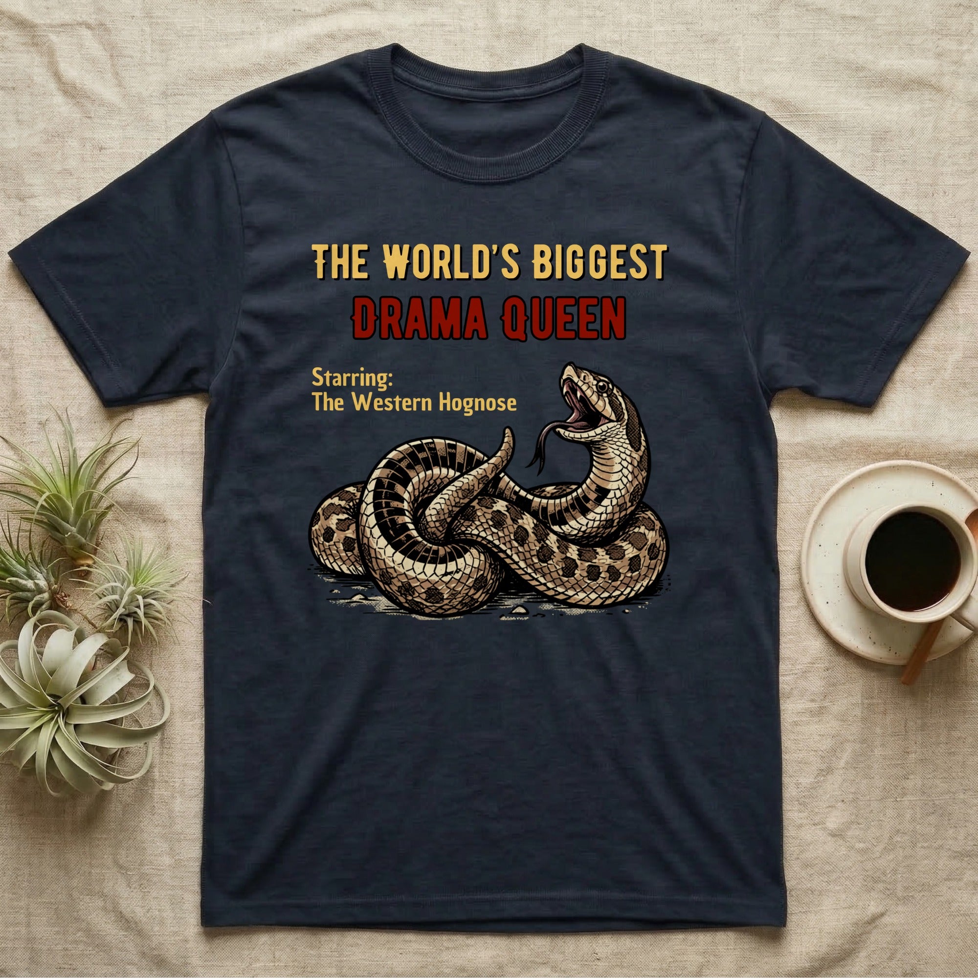 Dark t-shirt with coiled snake and text "The World's Biggest Drama Queen".