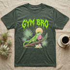 Green Anole Feral T-Shirt in Military Green — Green anole mid push-up with flared pink dewlap under a jagged neon-lime metal "GYM BRO" wordmark and pastel ferns.