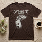 Corn Snake Shed T-Shirt in Dark Chocolate — Gritty white print of a corn snake head with milky pre-shed eyes under CAN'T COME OUT, I'M IN BLUE, on black