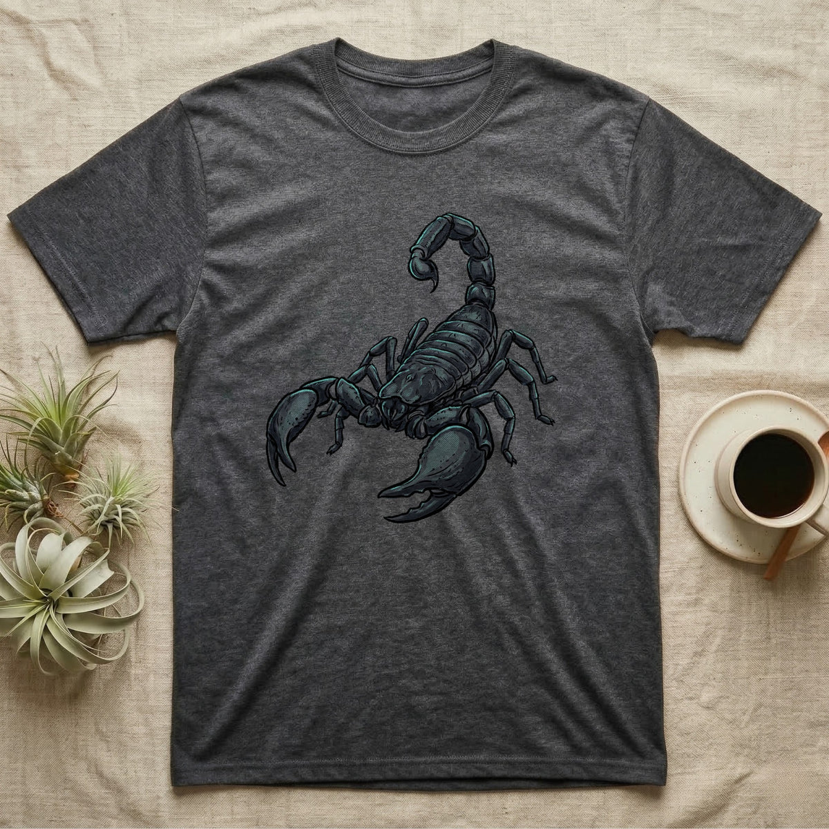 Glowing Emperor Scorpion T-Shirt in Dark Heather — Bold flat illustration of an emperor scorpion traced with a glowing blacklight-teal UV rim on a grey background.
