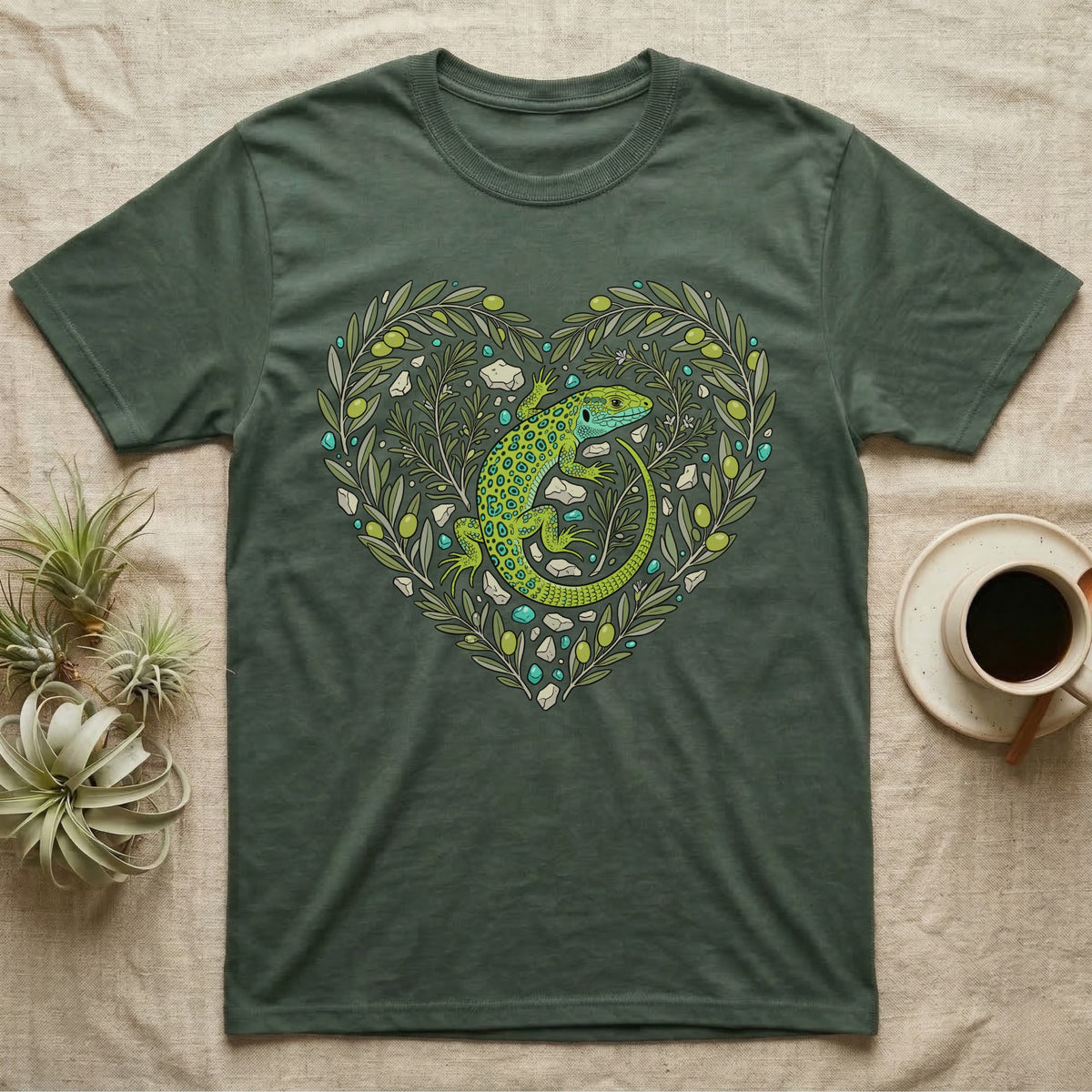 Green t-shirt with a heart-shaped olive branch design featuring a green lizard.