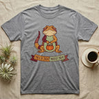 Bearded Dragon Mostly Treat T-Shirt in Sport Grey — Patchwork-quilt bearded dragon holding a pumpkin pail, banner reading "Trick or Treat? Mostly Treat."