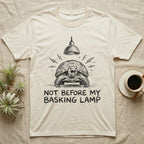 Russian Tortoise Mornings T-Shirt in Natural — Charcoal drawing of a grumpy Russian tortoise yelling up at a basking lamp above the words NOT BEFORE MY BASKING LAMP.
