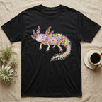 Axolotl Watercolour Mosaic T-Shirt in Black — Watercolour mosaic axolotl made of painted flowers and leaf blades, gill plumes fanned, petals trailing from its tail