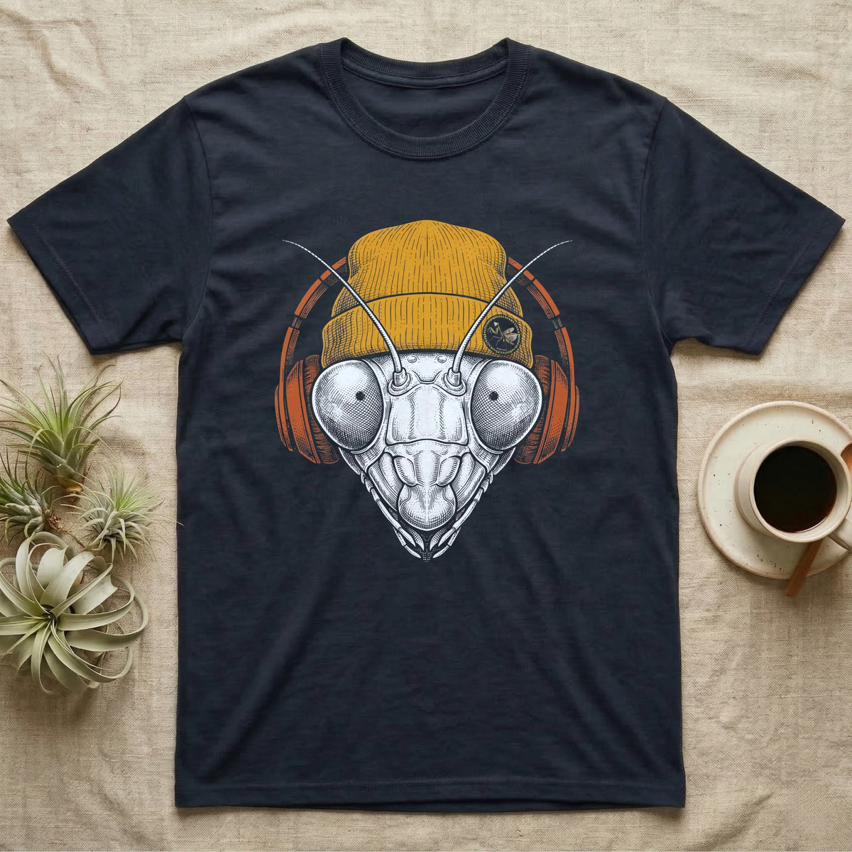 Praying Mantis Chill Beats T-Shirt in Navy — Engraved praying mantis with large compound eyes and antennae, wearing a knit beanie and over-ear headphones.