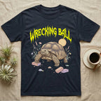Sulcata Tortoise Feral T-Shirt in Navy — Sulcata tortoise plodding over crumbled bricks under a jagged caution-yellow metal "WRECKING BALL" wordmark.