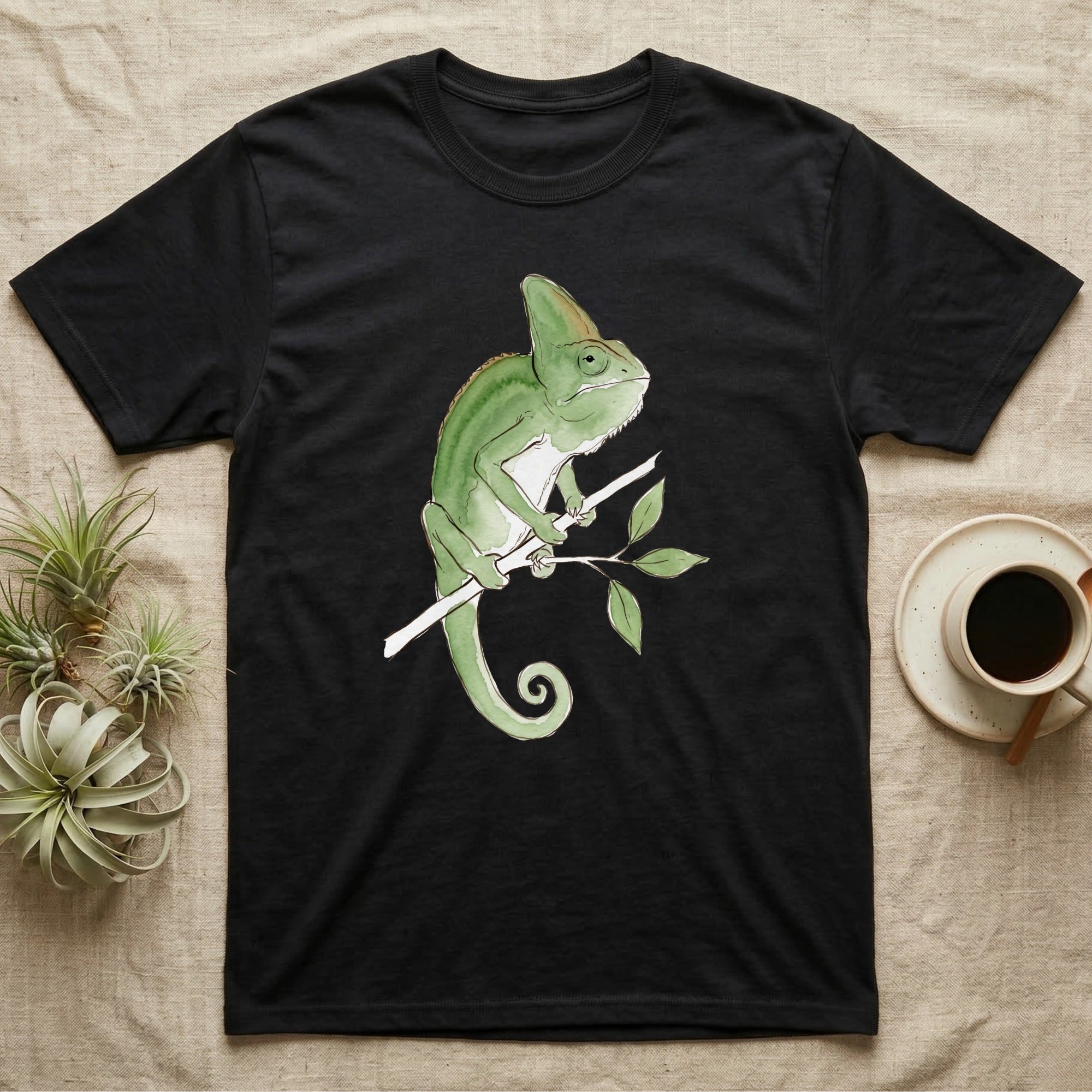 Veiled Chameleon Ambassador T-Shirt in Black — Watercolour illustration of a veiled chameleon calmly gripping a slender branch, tall casque and curled tail.