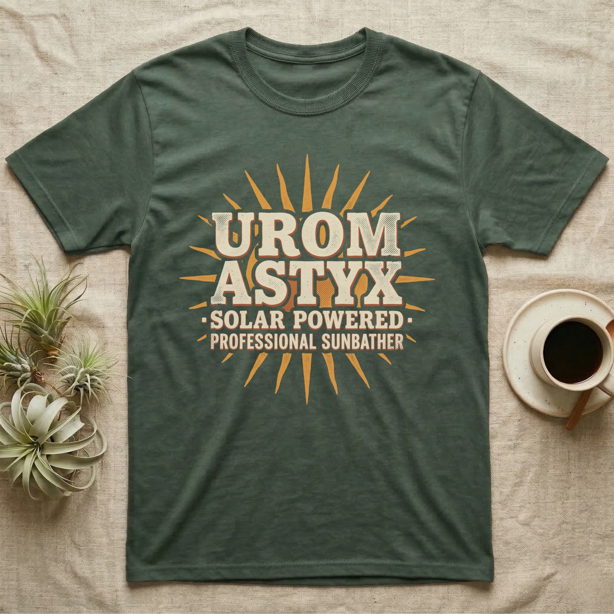 Solar Powered Uromastyx T-Shirt in Military Green — Desert-poster wordmark reading "Uromastyx Solar Powered Professional Sunbather" with a small radiating sun motif.