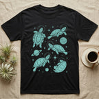 Red Eared Slider Cosmic T-Shirt in Black — Vintage screen-print illustration of red-eared slider turtles in astronaut helmets floating in space, cosmic teal monochromatic on dark background.