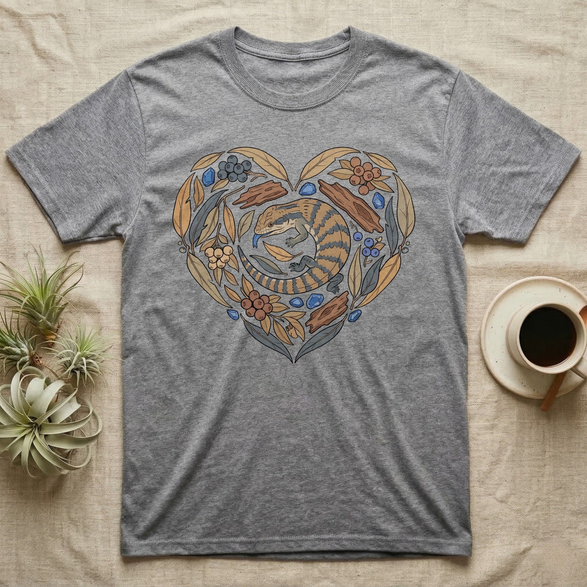 Grey t-shirt with heart-shaped floral design featuring an armadillo.
