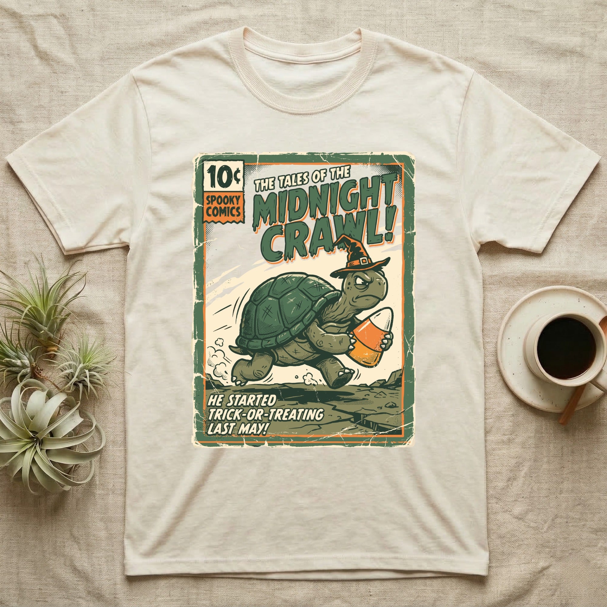 Tortoise Midnight Crawl Vintage T-Shirt in Natural — Worn pulp comic cover of a witch-hatted tortoise dashing with a candy pail, "Tales of the Midnight Crawl."