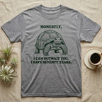 Sulcata Tortoise The Fence Lost T-Shirt in Sport Grey — Block-print sulcata tortoise mid-stride in one terracotta ink, ringed by the words THE FENCE LOST and it was in my way.