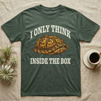 Box Turtle Thinker T-Shirt in Military Green — Engraved eastern box turtle shut in its shell, one eye peeking out, under I Only Think Inside the Box