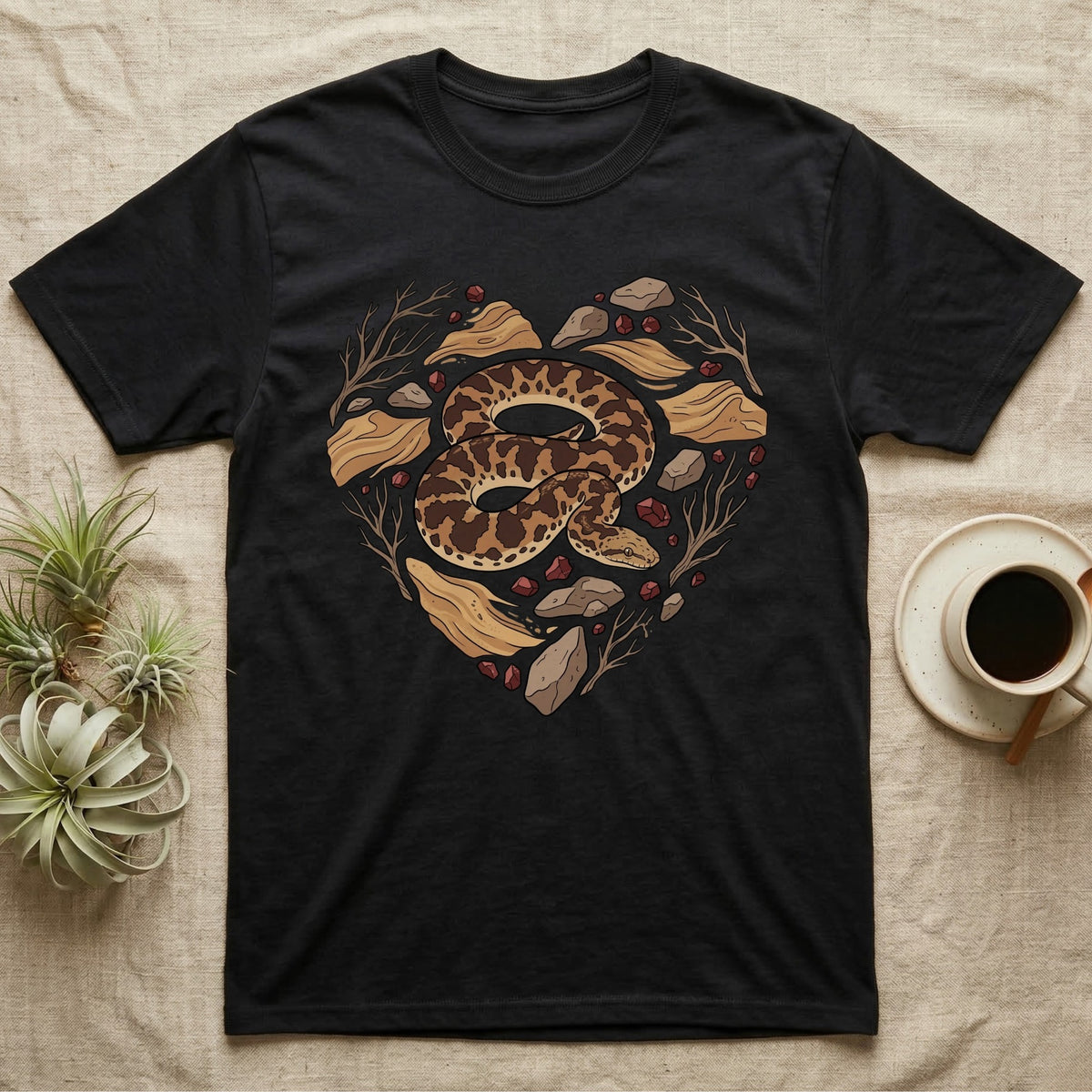 Black t-shirt with a heart-shaped snake and natural elements design.