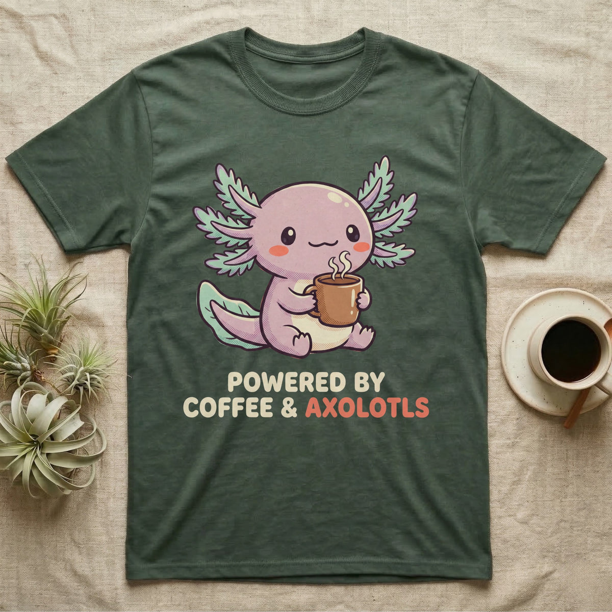 Coffee And Axolotls T-Shirt in Military Green — Kawaii chibi illustration of an axolotl holding a coffee cup with soft text reading Powered By Coffee And Axolotls.