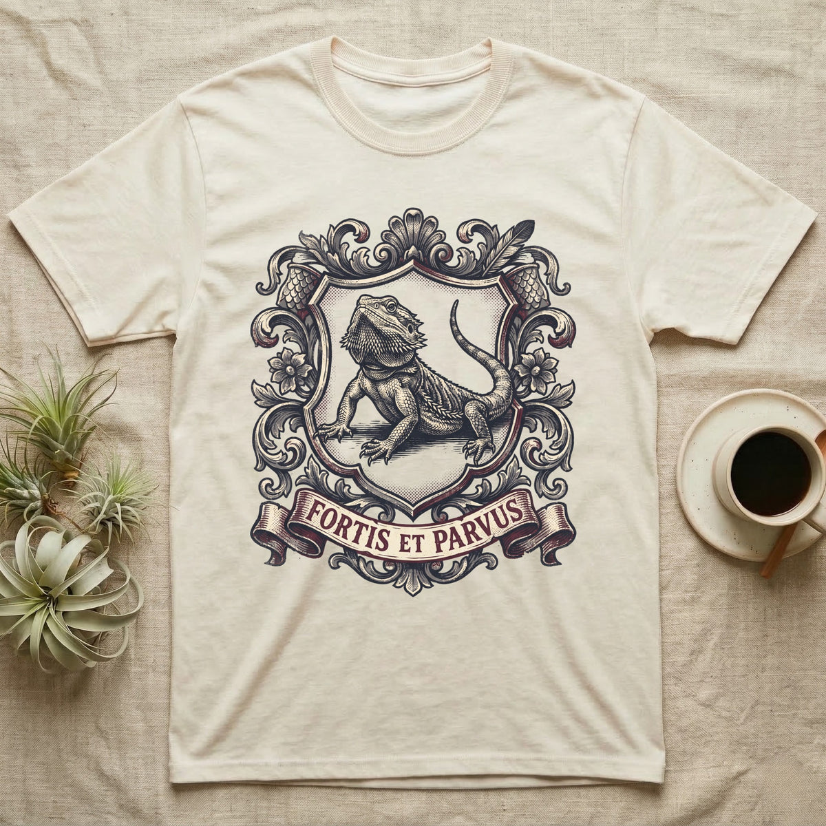 Bearded Dragon Heraldry T-Shirt in Natural — Engraved heraldic crest of a bearded dragon posed as a regal dragon on a shield with a ribbon banner.