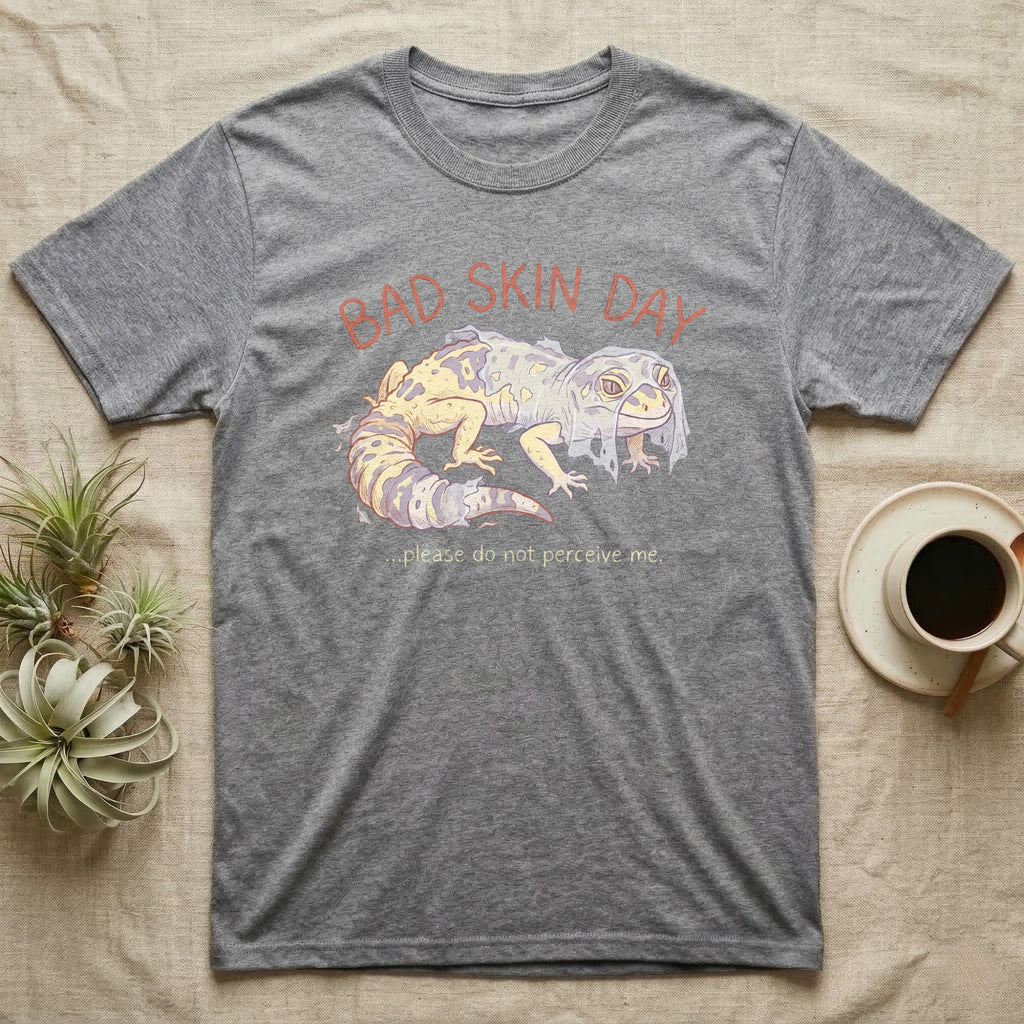 Gray t-shirt with a distressed gecko graphic and text "BAD SKIN DAY".