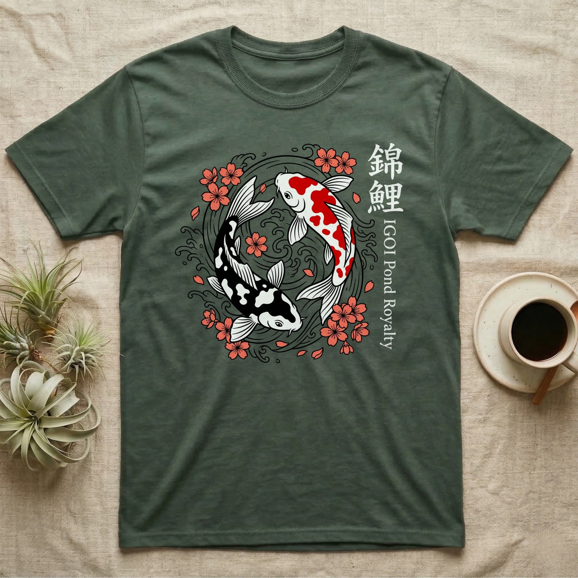 Green t-shirt with black and white koi fish and pink cherry blossoms.