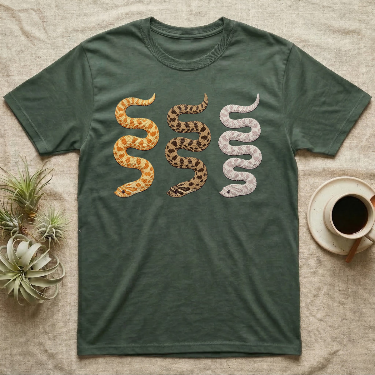 Hognose Morph Triptych T-Shirt in Military Green — Palette-knife painting of three western hognose snakes side by side, albino, anaconda and snow morphs.