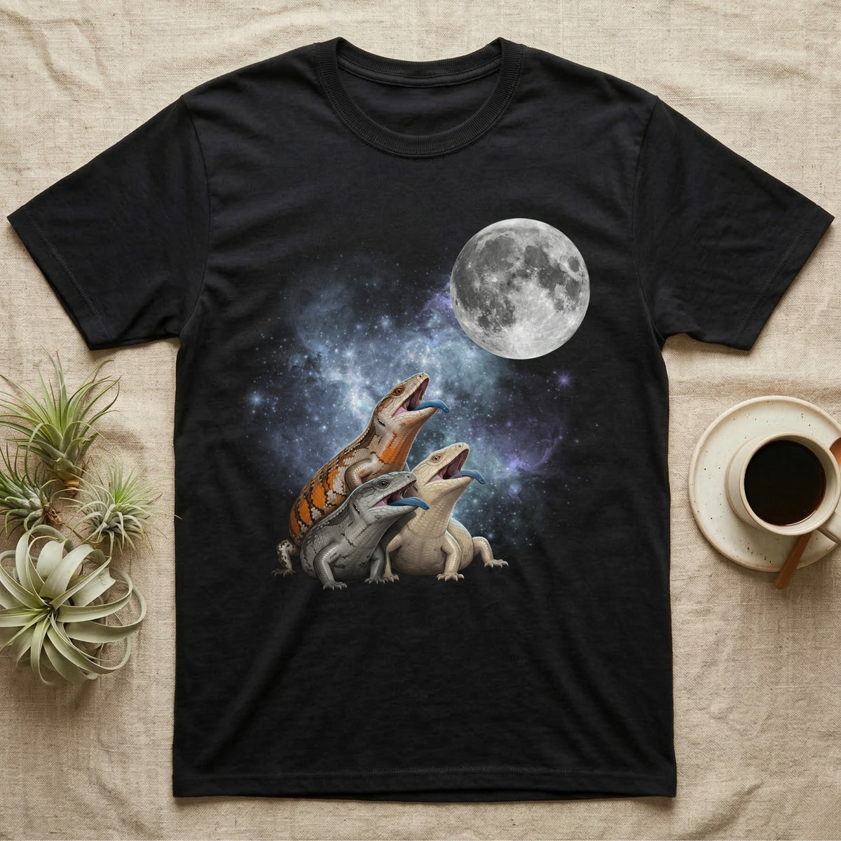 Blue-Tongued Skink Moon Howl T-Shirt in Black — Three Blue-Tongued Skink colour morphs howling at a full moon over a nebula on a dark grey t-shirt.