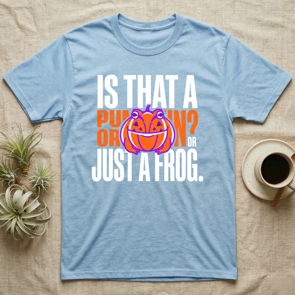 Frog Jack-O'-Lantern Illusion T-Shirt in Light Blue — Typographic graphic of an orange frog doubling as a jack-o'-lantern, "Is That a Pumpkin? Or Just a Frog."