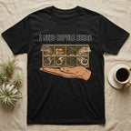 Crested Gecko Rehab T-Shirt in Black — Vector scene of a hand presenting a rack of four crested geckos under a marker-style reptile rehab caption.