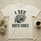 Panther Chameleon Mediator T-Shirt in Natural — Etching of a panther chameleon holding a twig, its eyes pointing opposite ways, under I SEE, above BOTH SIDES