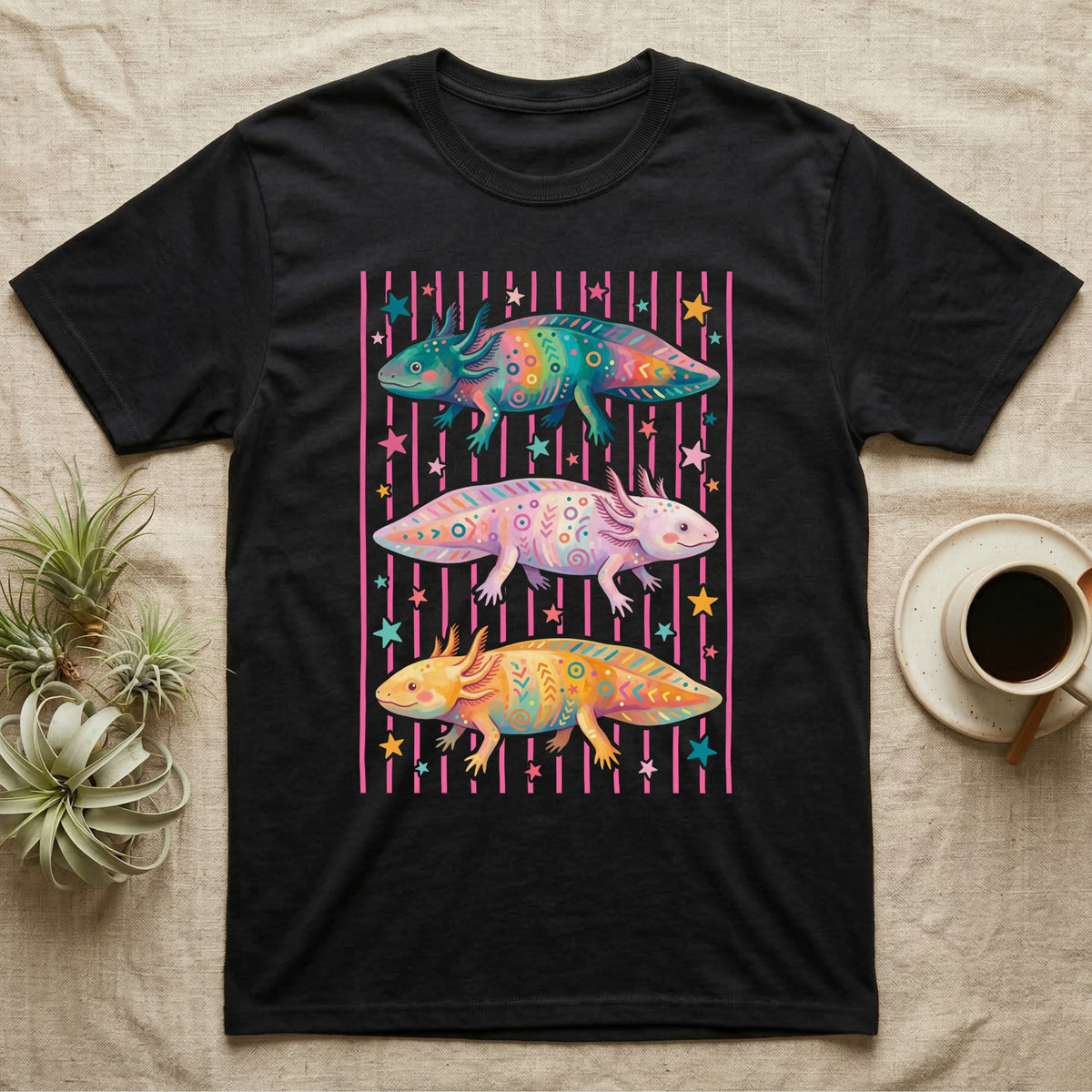 Axolotl Colourways Candy Stripe T-Shirt in Black — Three gouache axolotls stacked in bands on pink candy stripes, facing left, right and left, with scattered stars