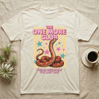 Corn Snake Club T-Shirt in Natural — Engraved corn snake sitting deadpan under pink lettering The One More Club, with This is definitely the last one below, on yellow stripes