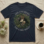 Crested Gecko Care Sheet T-Shirt in Navy — Botanical wreath of pothos and moss circling a crested gecko, closed by two arcs of Roman capitals.
